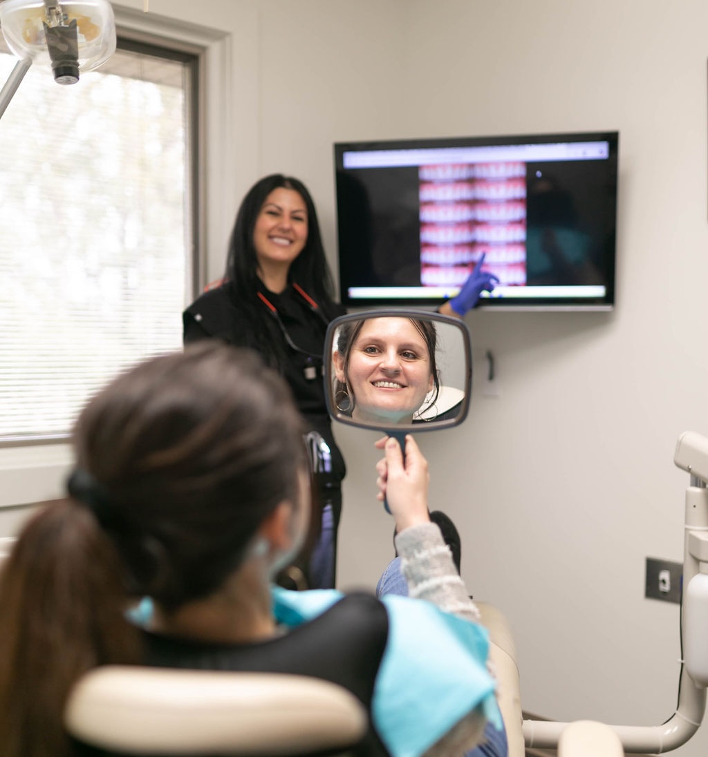 Dentist showing patient results